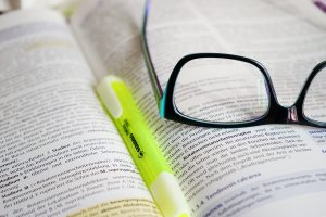 Pair of glasses on a book